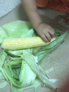 Ask your eager toddler to help with prep by having them shuck the corn.  Just make sure you have a paper bag handy to minimize the mess from the silks.